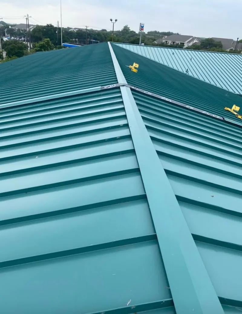 Green commercial metal roof ridge and valley for Metal Roof Repair in Hibbing